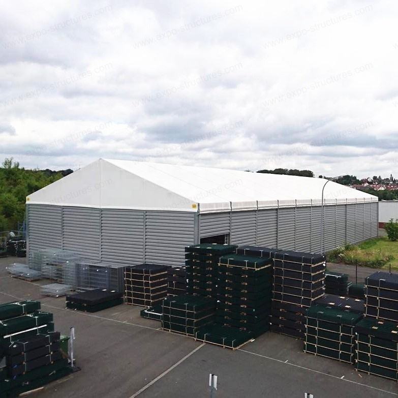 خيمة تخزين مستودع صناعي كبير مقاوم للأشعة فوق البنفسجية PVC مقاوم للماء مقاوم للحريق ساندويتش صفائح فولاذية متينة شعار للاستخدام الخارجي